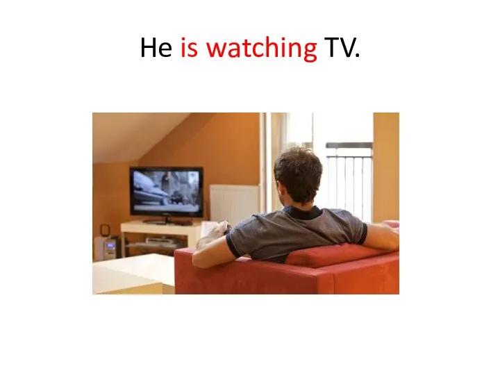 He is watching TV.