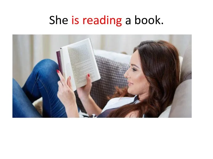 She is reading a book.