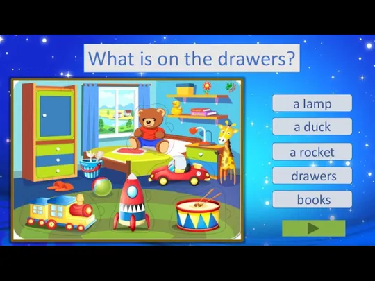 What is on the drawers? a lamp a duck a rocket drawers books