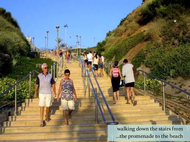 walking down the stairs from the promenade to the beach…