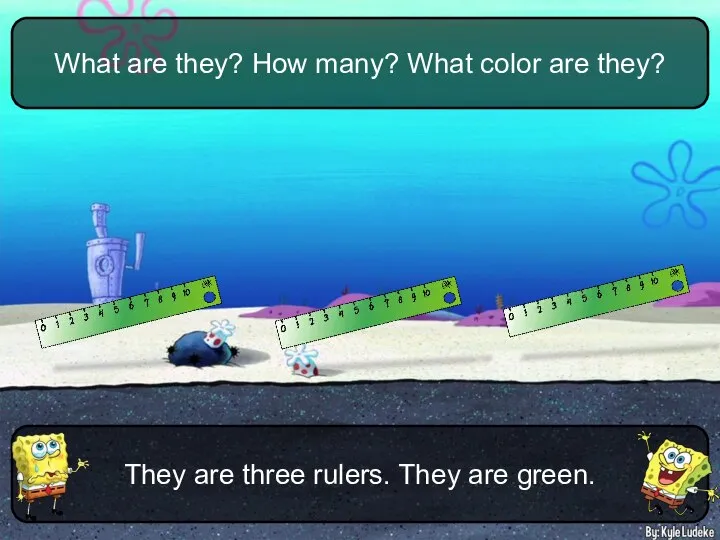 They are three rulers. They are green. What are they? How many? What color are they?