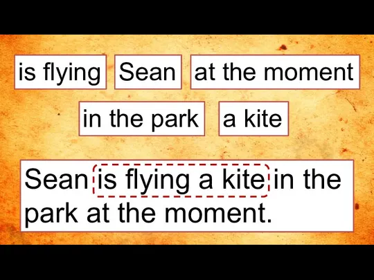 is flying Sean is flying a kite in the park at the