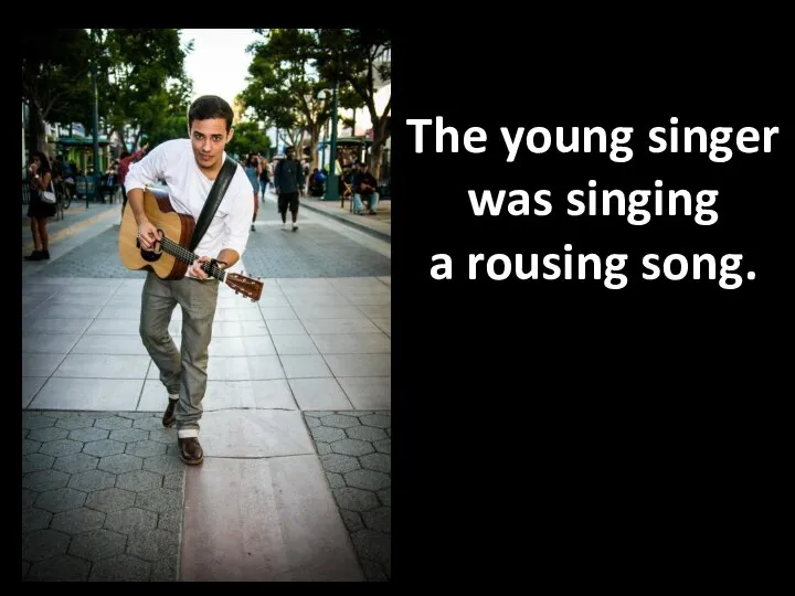 The young singer was singing a rousing song.