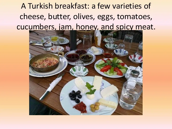 A Turkish breakfast: a few varieties of cheese, butter, olives, eggs, tomatoes,