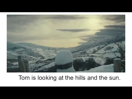 Tom is looking at the hills and the sun.