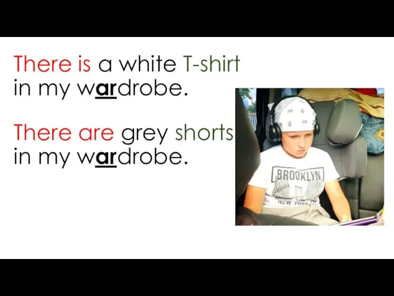 There are grey shorts in my wardrobe. There is a white T-shirt in my wardrobe.