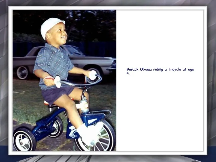 Barack Obama riding a tricycle at age 4.