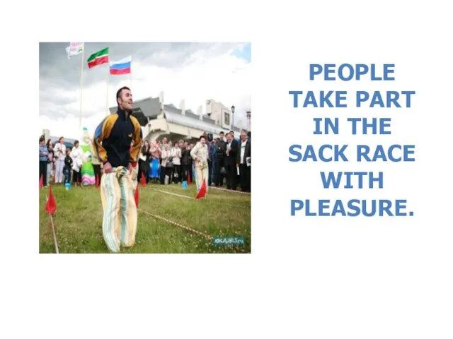 PEOPLE TAKE PART IN THE SACK RACE WITH PLEASURE.