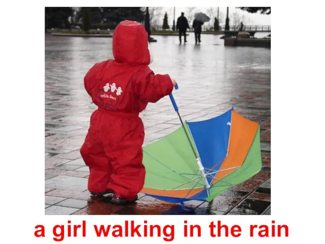 a girl walking in the rain