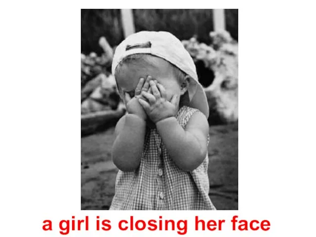 a girl is closing her face