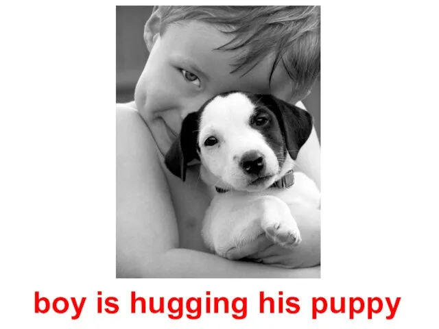 boy is hugging his puppy