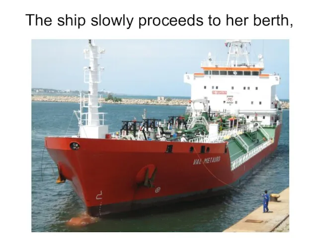 The ship slowly proceeds to her berth,