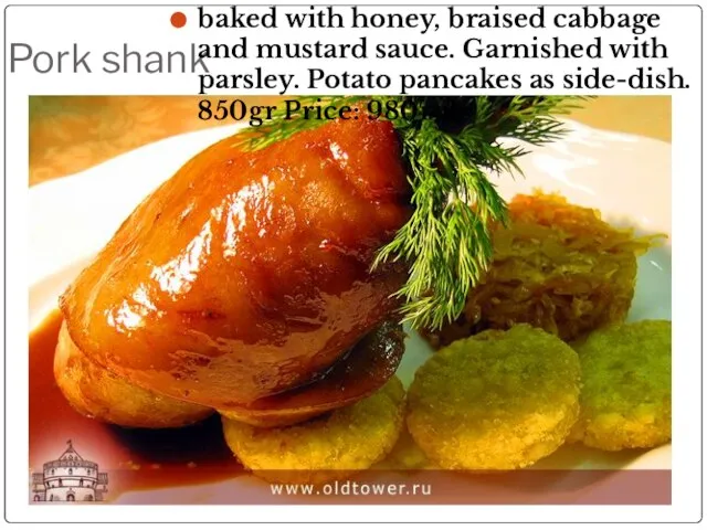 Pork shank baked with honey, braised cabbage and mustard sauce. Garnished with