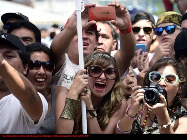 Fans take photos at the end of stage six in Iquique, Chile .photographer Franck Fife AFP