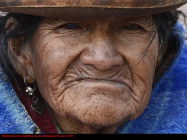 A Bolivian woman is slightly less excited. photographer Franck Fife AFP