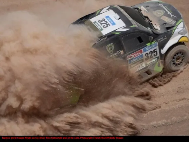Toyota’s driver Yazeed Alrajhi and co-driver Timo Gottschalk take on the sand. Photograph: Franck Fife/AFP/Getty Images