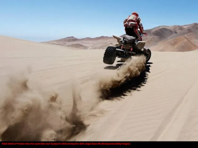 Rafal Sonik of Poland rides his quad bike near Iquique in Chile