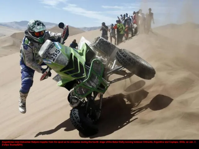 Argentinian rider Sebastian Halpern topples from his quad as he competes during