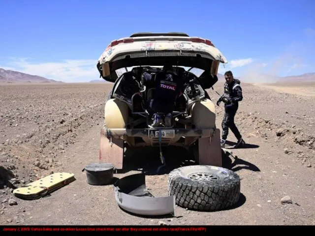 January 7, 2015: Carlos Sainz and co-driver Lucas Cruz check their car