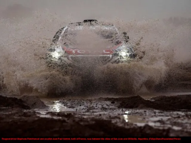 Peugeot driver Stephane Peterhansel and co-pilot Jean Paul Cottret, both of France,