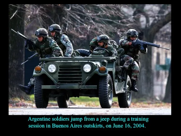 Argentine soldiers jump from a jeep during a training session in Buenos