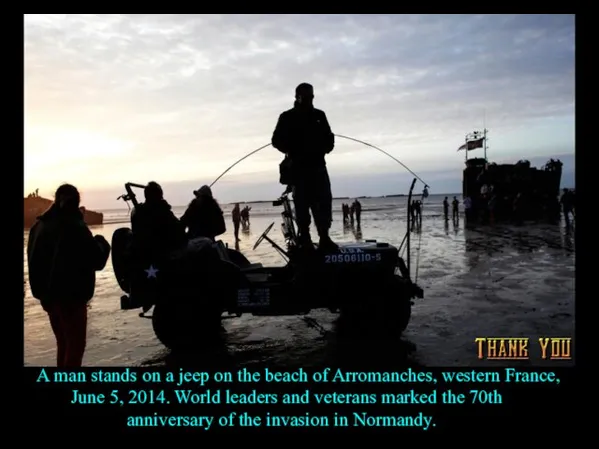 A man stands on a jeep on the beach of Arromanches, western