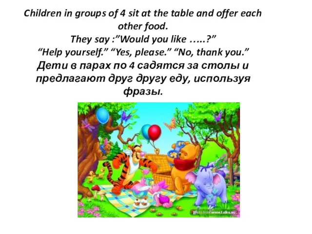 Children in groups of 4 sit at the table and offer each