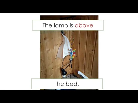 The lamp is above the bed.