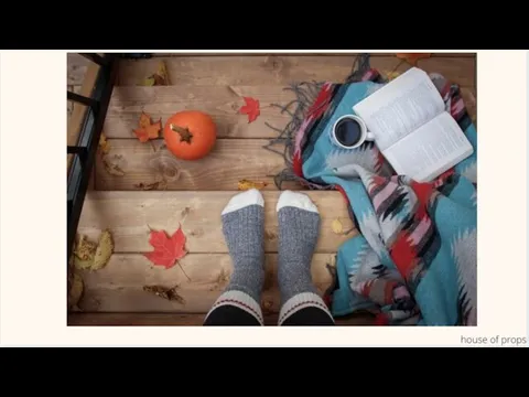 Is the book on the left or on the right of the cup?