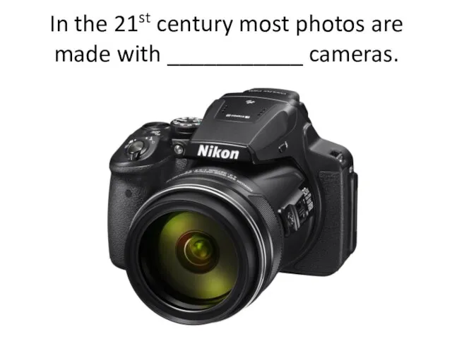 In the 21st century most photos are made with ___________ cameras.