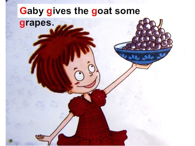 Gaby gives the goat some grapes.
