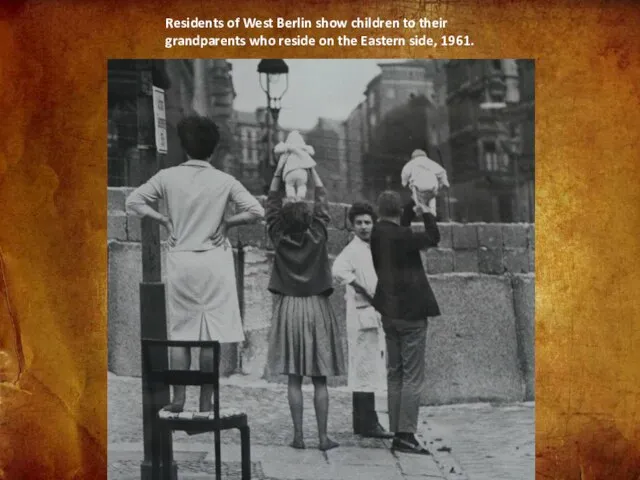 Residents of West Berlin show children to their grandparents who reside on the Eastern side, 1961.