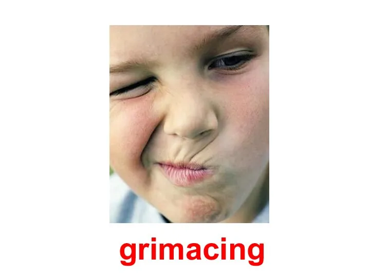 grimacing