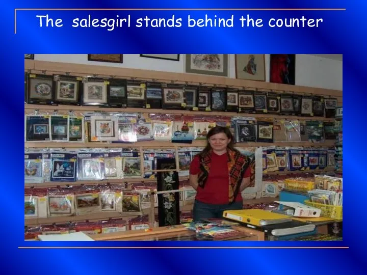 The salesgirl stands behind the counter